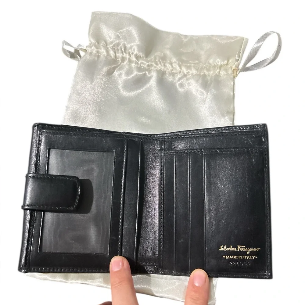 Authentic Ferragamo black leather trifold wallet gold with callouts